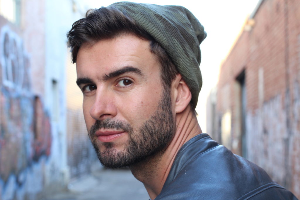 Portrait of handsome brunette bearded man